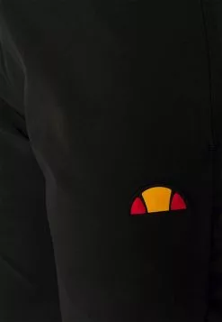 Ellesse PAIRED TRACK PANT - Pantalon De Survêtement - Black -Ellesse Elegant Boutique 4b351eec41df4a219ab1ac6b0a52f707