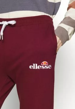 Ellesse NIORO TRACK PANT - Pantalon De Survêtement - Burgundy -Ellesse Elegant Boutique 8e3a670641314e1082e220dee5f77f48