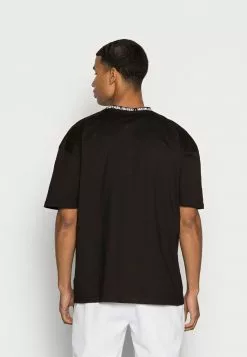 Ellesse FLEXXED TEE - T-shirt Basique - Black -Ellesse Elegant Boutique ad8138456c1d4e23a590810d389e4247