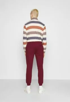 Ellesse NIORO TRACK PANT - Pantalon De Survêtement - Burgundy -Ellesse Elegant Boutique be267e0d146e40aaae251f1376b1fc07